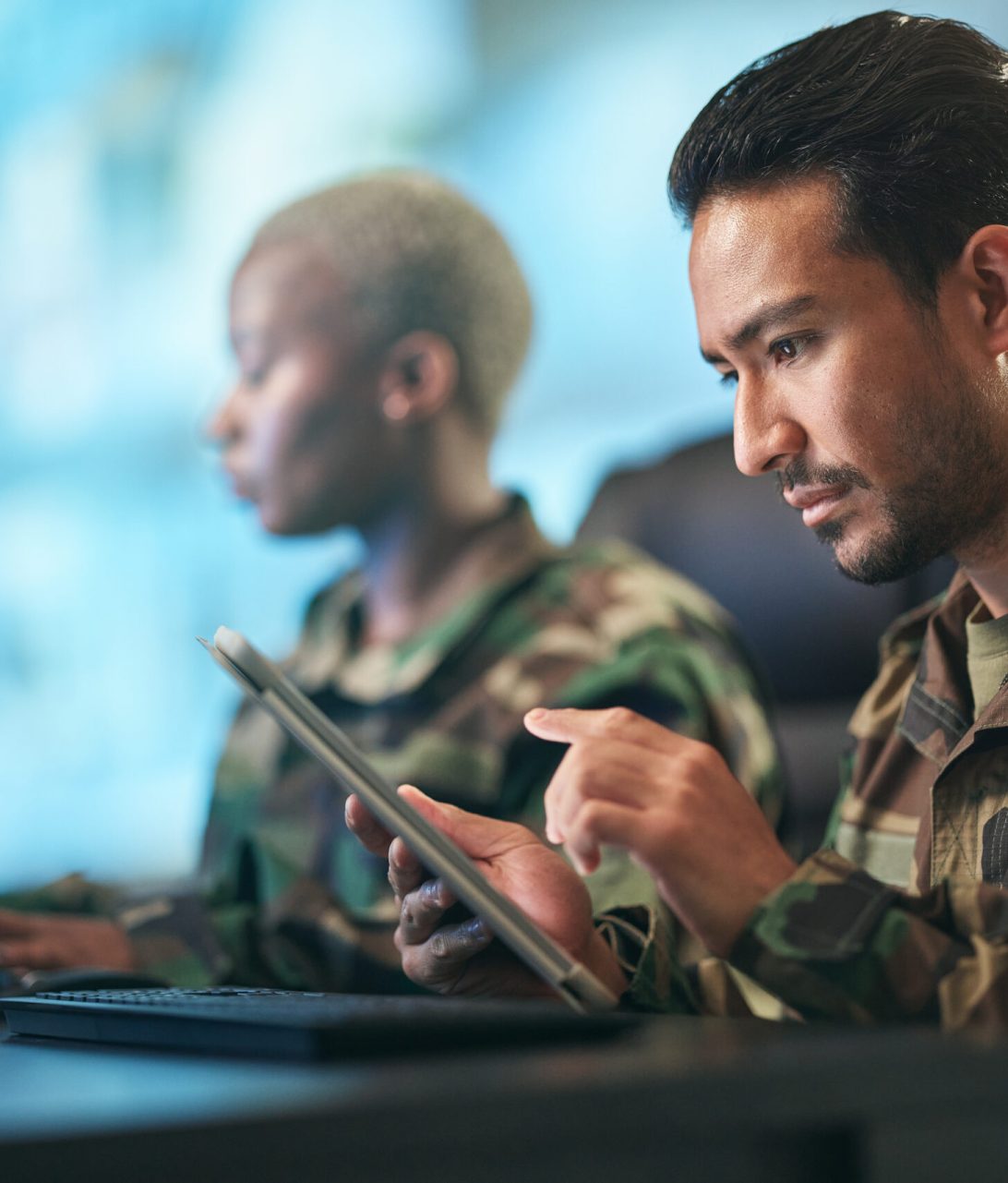 Asian man, army and tablet in research for military equipment, browsing or checking data at base. Male person, security or soldier working on technology for online search or networking at workplace